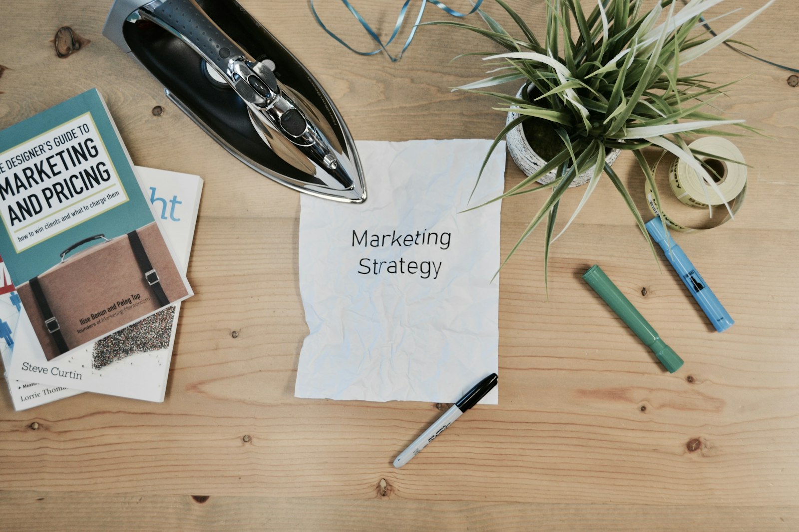 Printed marketing strategy document on a desk, representing planning a SaaS content marketing program
