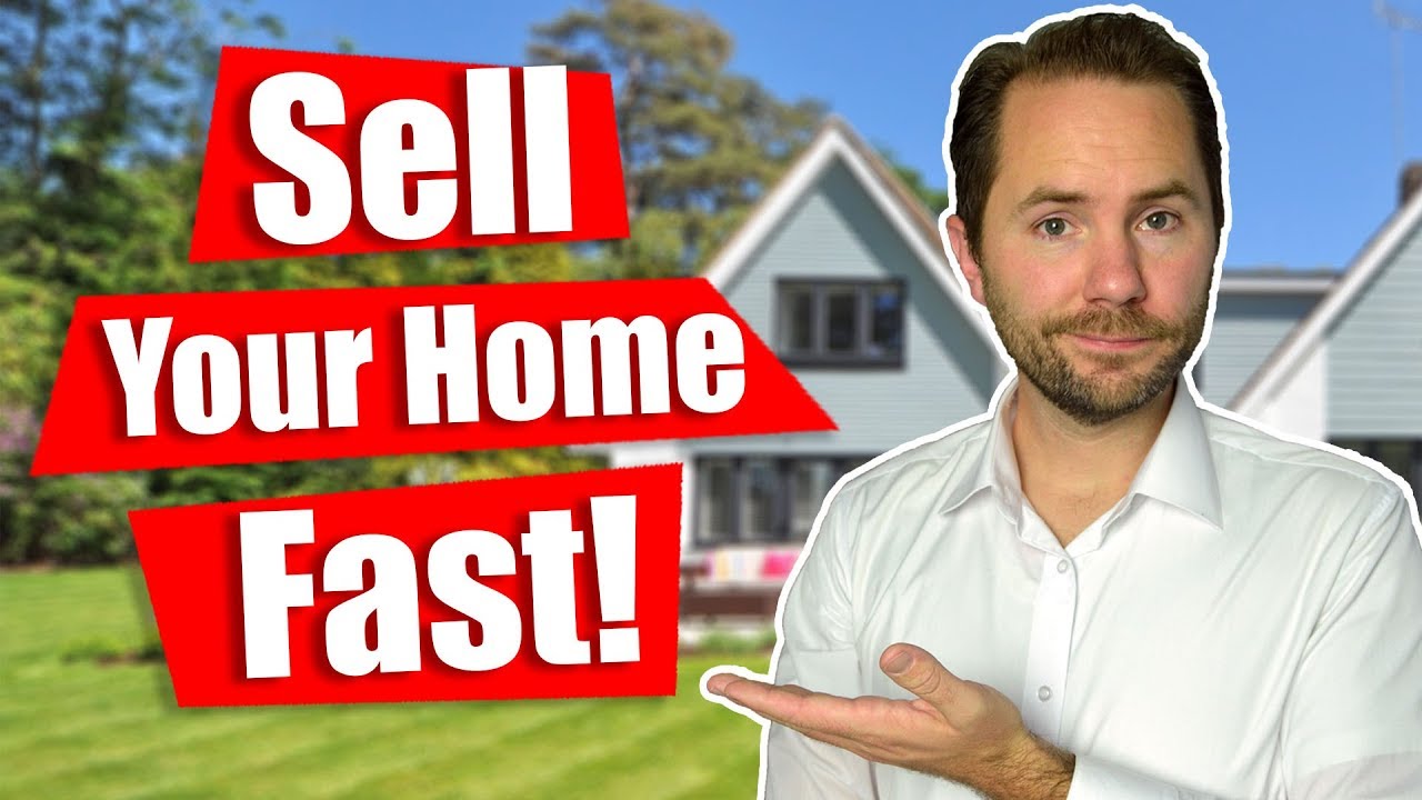 A residential house with a 'For Sale' sign in the front yard.